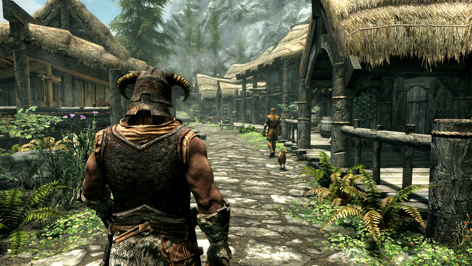 The Dragonborn walking through a town in The Elder Scrolls V: Skyrim.
