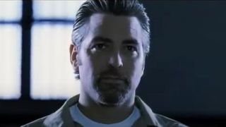 George Clooney with facial hair in prison in Ocean's Eleven.