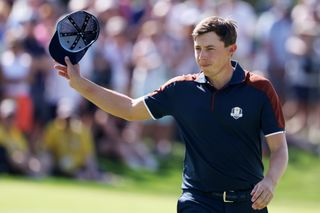 Matt Fitzpatrick waves to the crowd whilst holding his cap