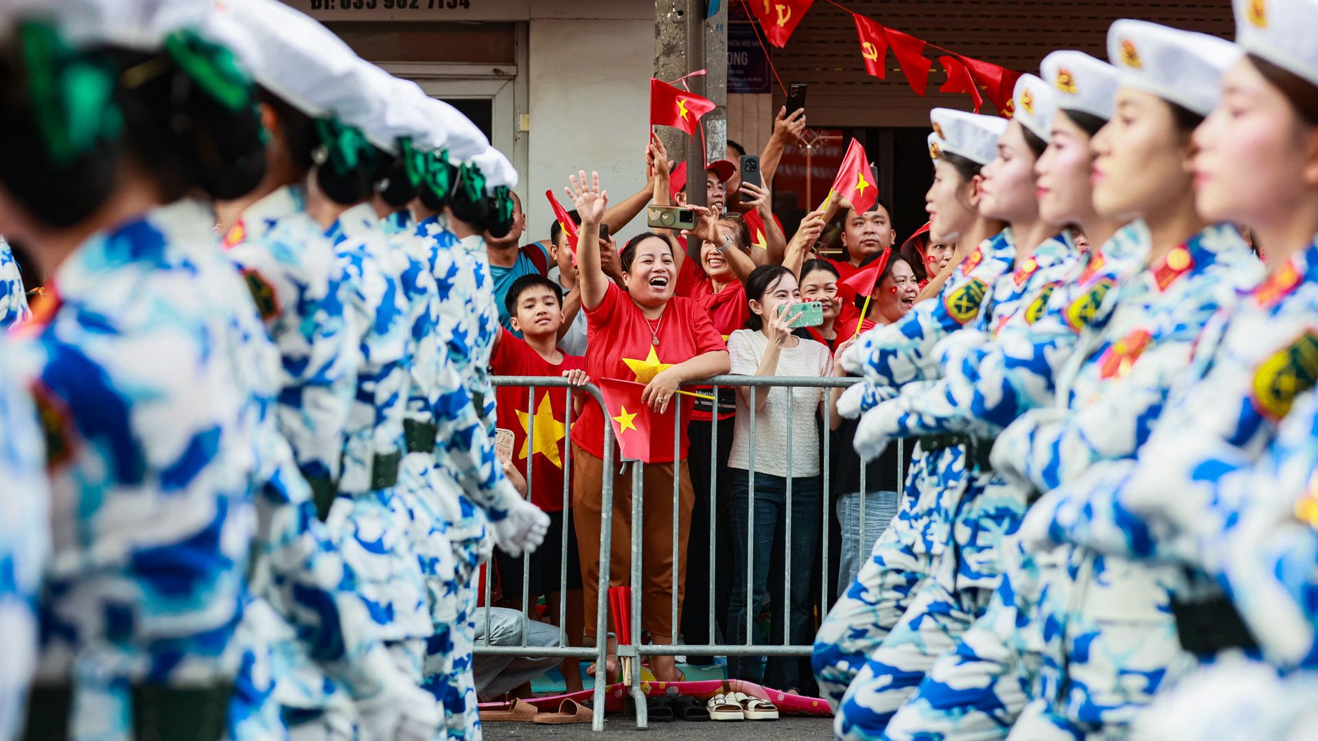 
                                A crowd cheers as soldiers march during Vietnam&#039;s 80th National Day celebrations in Hanoi
                            
