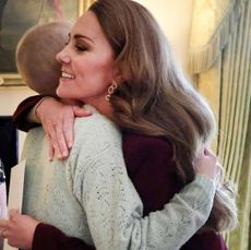 Kate Middleton hugging a teenage cancer patient