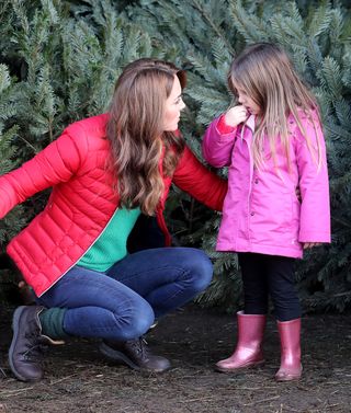 helps children choose a Christmas tree as she joins families and children who are supported by the charity Family Action at Peterley Manor Farm on December 4, 2019 i
