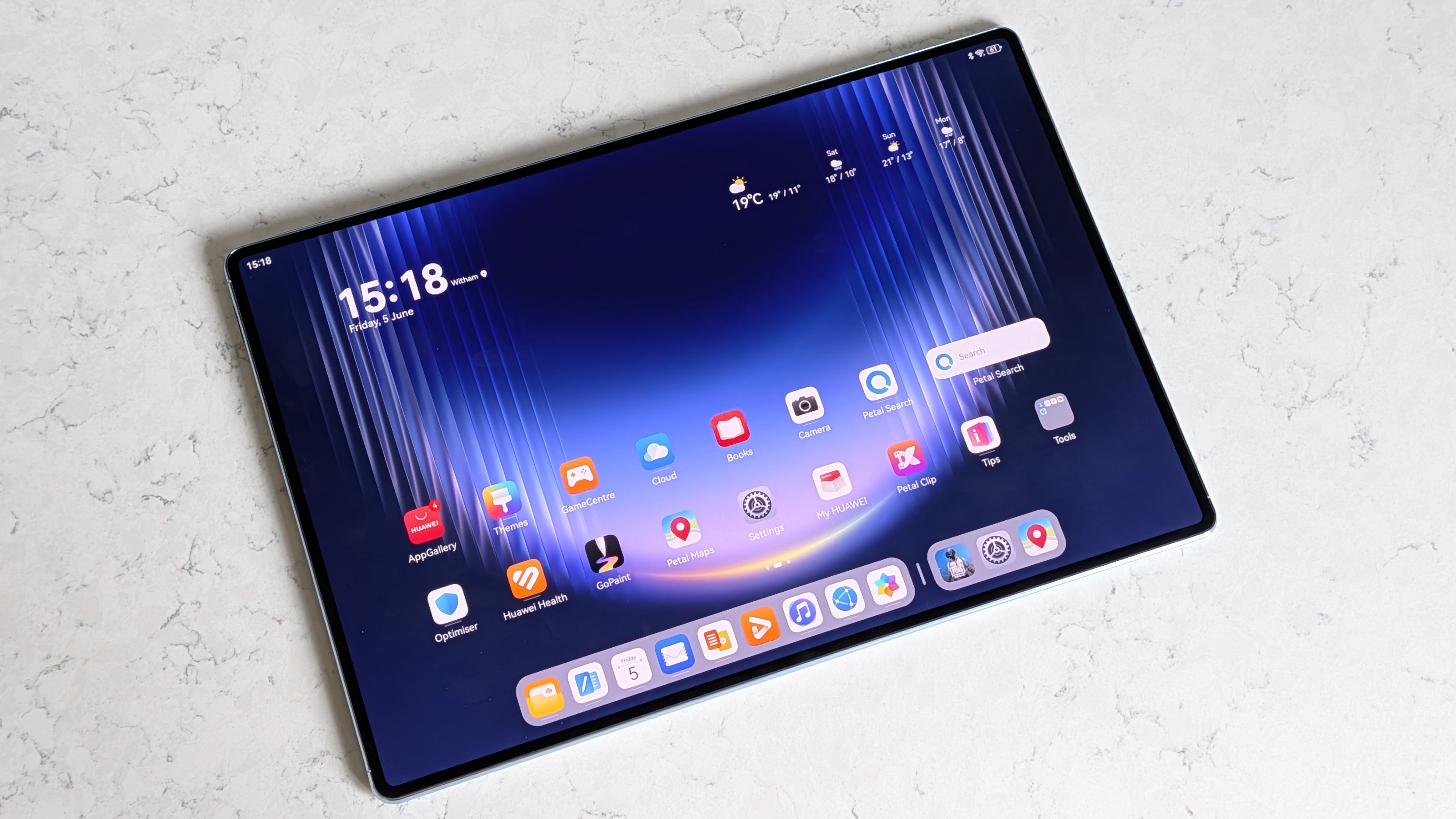 Photos of the Huawei MatePad Pro Max resting on a marble table