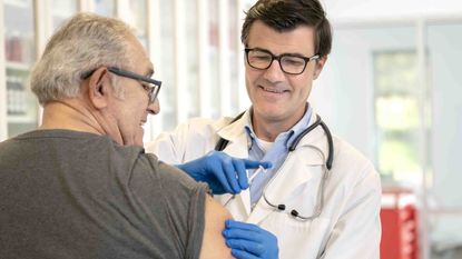 Photo of a man getting a vaccine
