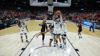 Caleb Daniels #14 of the Villanova Wildcats makes a defensive rebound against the Houston Wildcats during the Elite Eight round of the 2022 NCAA Mens Basketball Tournament held at AT&T Center on March 26, 2022 in San Antonio, Texas.