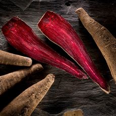 crapaudine beetroots, one sliced open to show bright red inside 