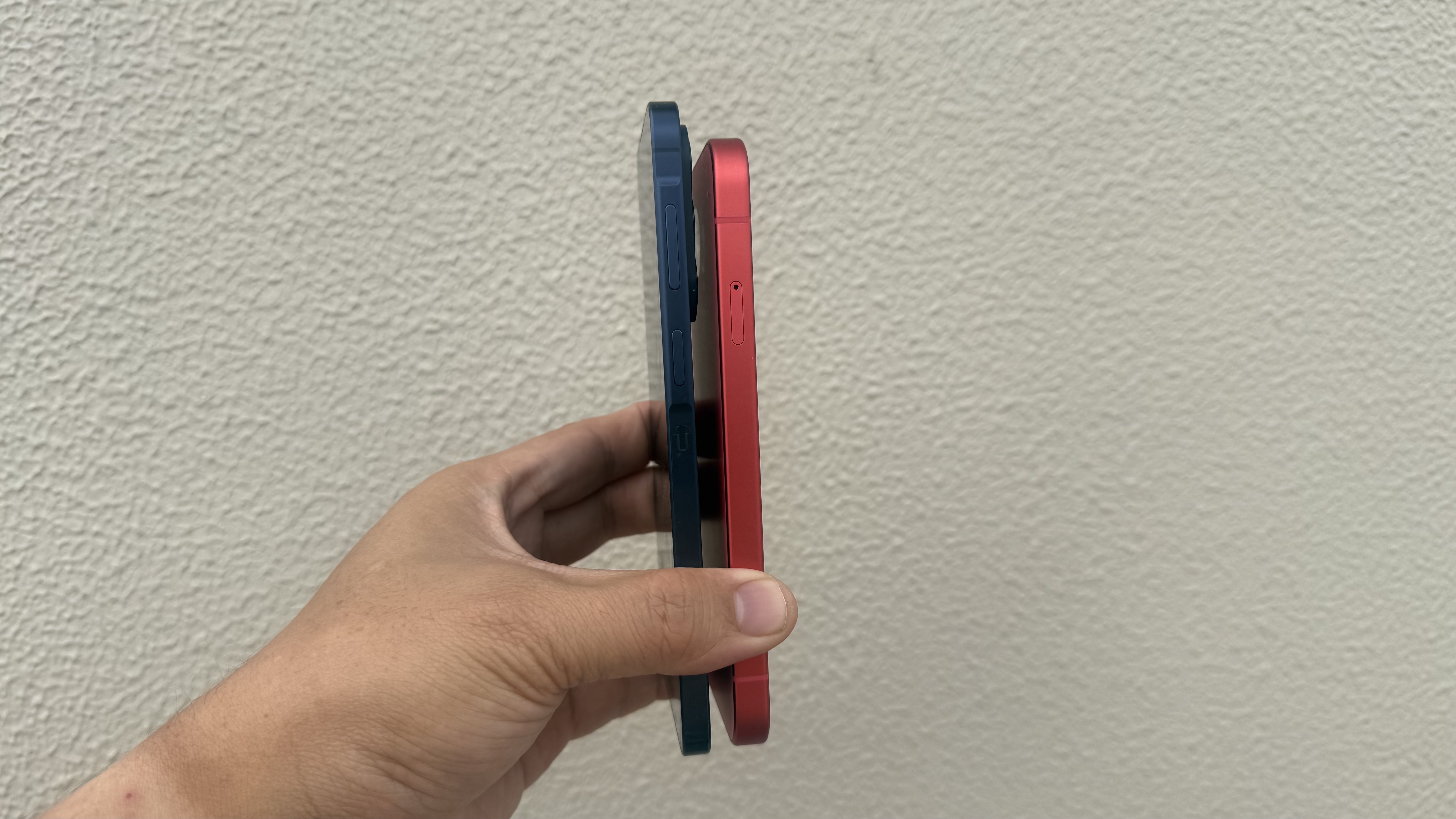 The Samsung Galaxy A57 and the Google Pixel 10a held side by side