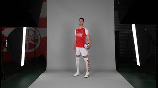 Declan Rice poses in an Arsenal shirt following his signing for the Gunners in the summer of 2023.