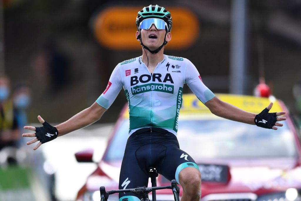 Stage winner Team Bora rider Germanys Lennard Kamna celebrates as he crosses the finish line of the 16th stage of the 107th edition of the Tour de France cycling race 164 km between La Tour du Pin and VillarddeLans on September 15 2020 Photo by Stuart Franklin POOL AFP Photo by STUART FRANKLINPOOLAFP via Getty Images