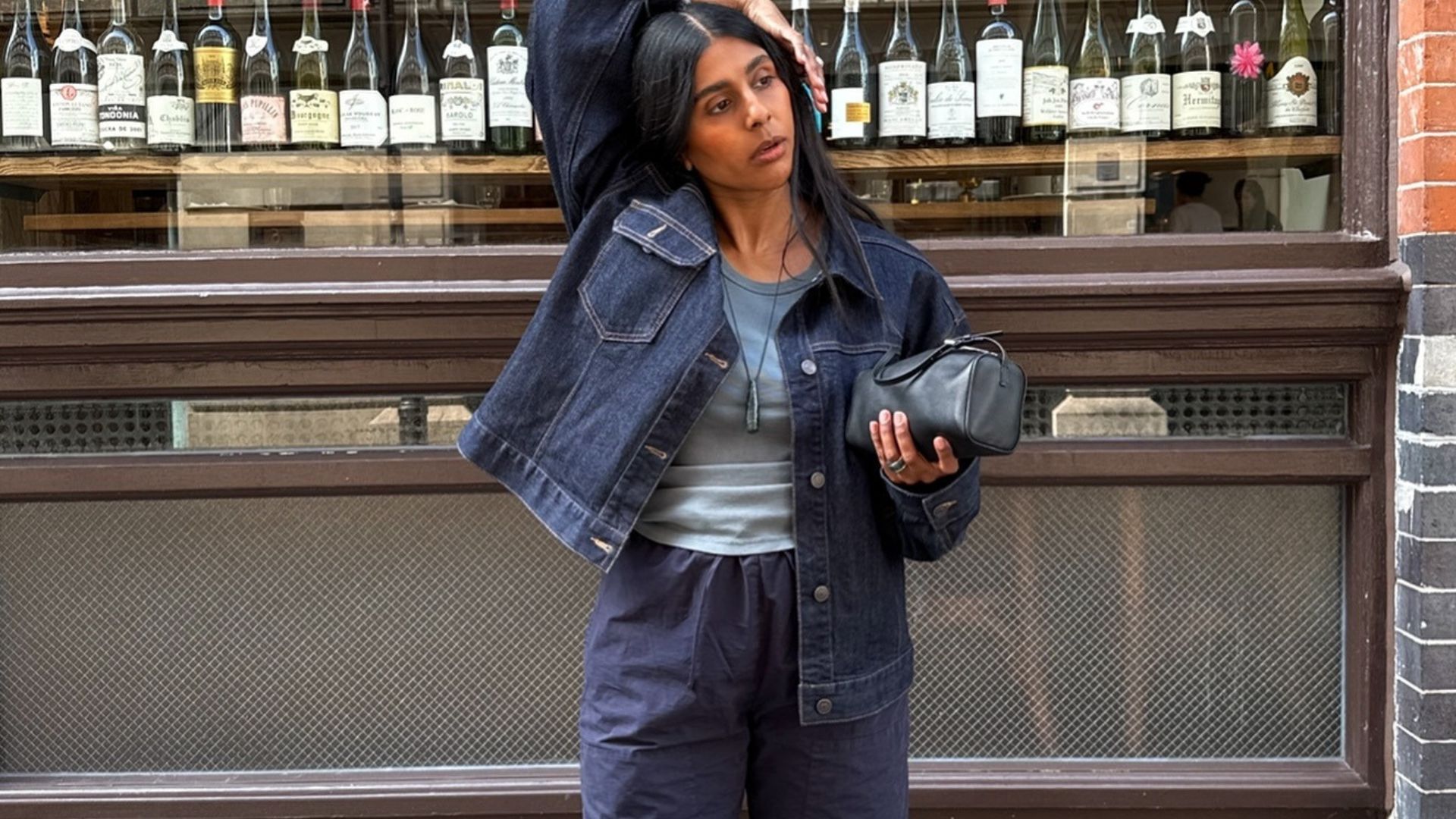 Monikh wearing leset trousers in navy