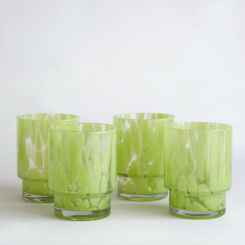 Four light green coloured tortoiseshell tumbler glasses is a unique tortoiseshell homeware piece.
