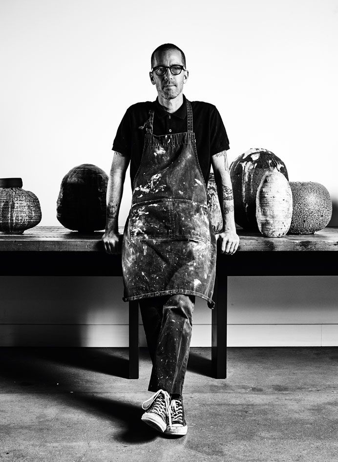 Potter Adam Silverman with some of his works at his studio in Glendale, Los Angeles County