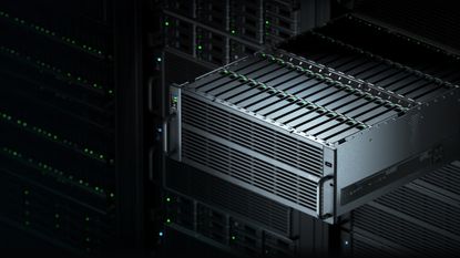 A server extended out from a rack of similar servers in a dark room