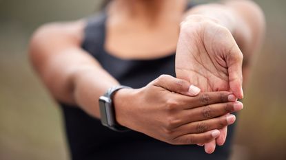 Person doing wrist exercise
