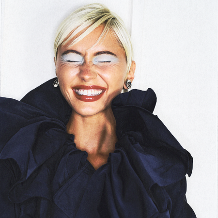 Iris Law poses on the cover of Who What Wear for the 20th Anniversary October 2026 edition