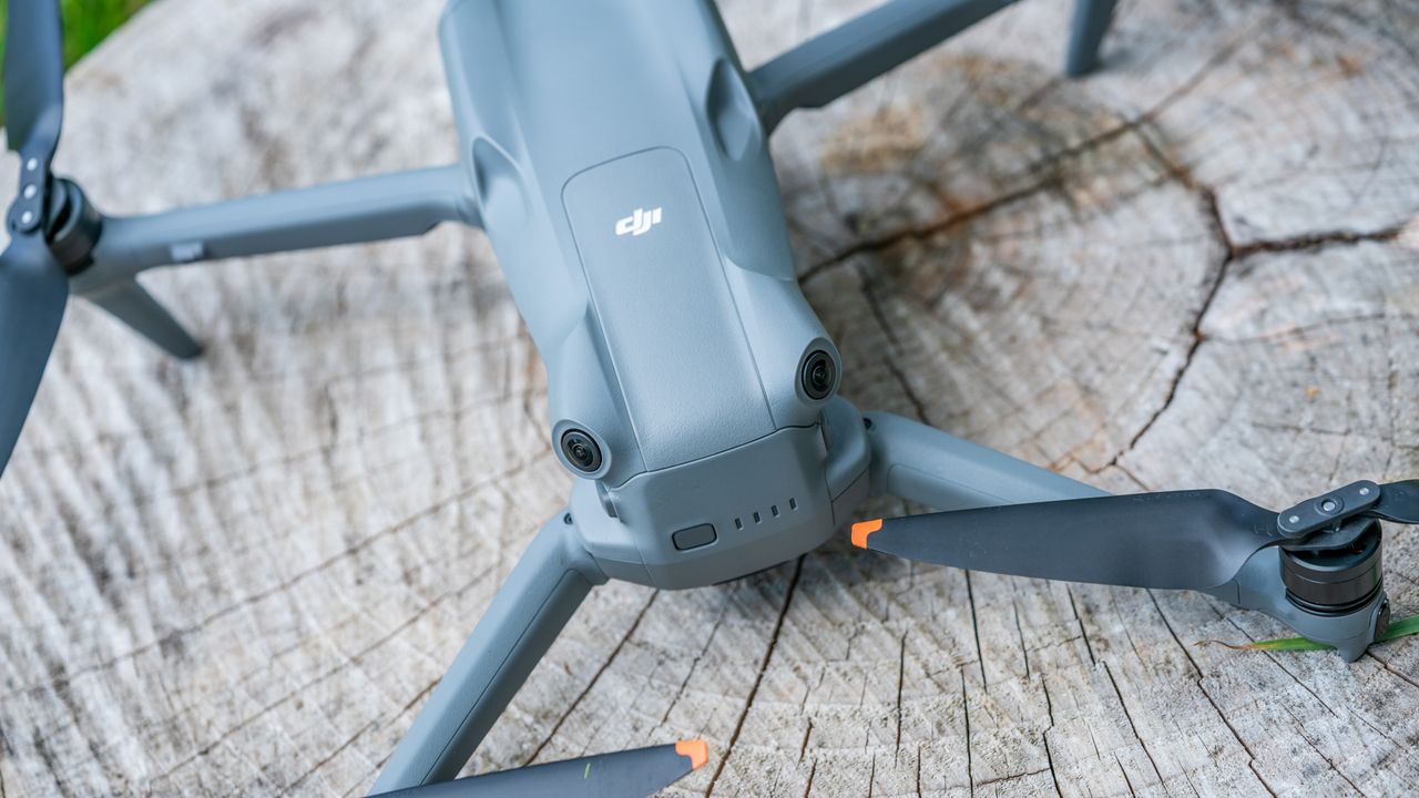 DJI Air 3 drone on a tree stump view of the back