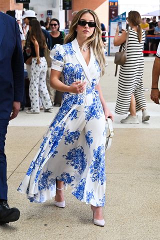 Sydney Sweeney wearing a blue floral dress.