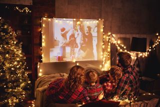 Family festive film night showing a classic Christmas party theme