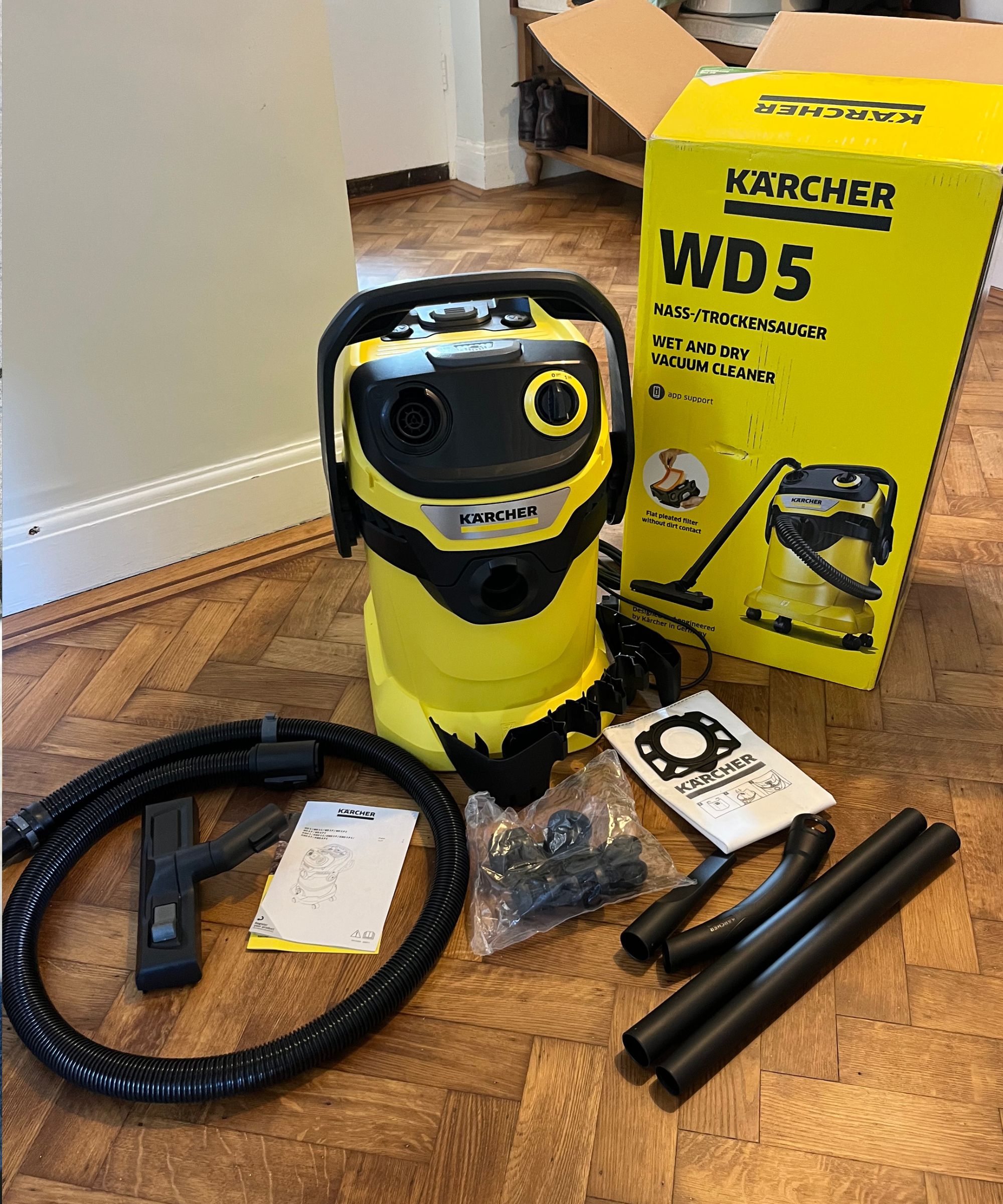 Unboxing the Karcher WD5 P with all packaging removed and accessories on the floor