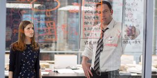 The Accountant Anna Kendrick and Ben Affleck looking over numbers on the wall