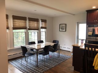 dining room by windows in home before redesign