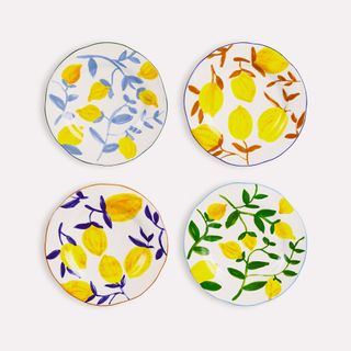 Four plates with a lemon print