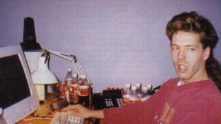 julian lefay working on his pc at his desk