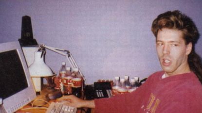 julian lefay working on his pc at his desk