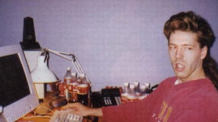 julian lefay working on his pc at his desk