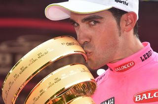 Alberto Contador kisses the winner' trophy