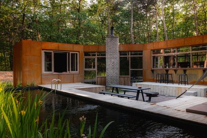 A natural pool with corten steel building