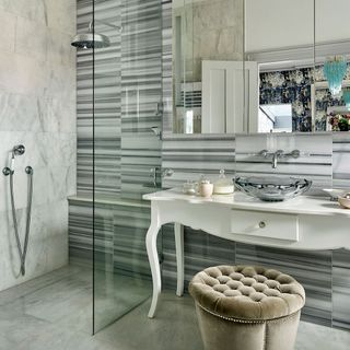 bathroom with shower area and washbasin area