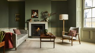 living room with open fire and cream coloured carpet