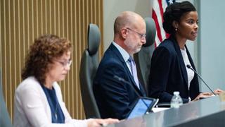 Anna Gomez, commissioner at the Federal Communications Commission (FCC), from left, Brendan Carr, commissioner at the Federal Communications Commission (FCC), and Olivia Trusty, commissioner at the Federal Communications Commission (FCC), during an open commission meeting at the Federal Communications Commission (FCC) headquarters in Washington, DC, US, on Tuesday, Sept. 30, 2025. The commission voted Tuesday to seek public comment on whether to revoke a rule that bars a single company from owning more than two stations in a local market and another that prevents the major broadcast networks from combining. Photographer: Kent Nishimura/Bloomberg via Getty Images
