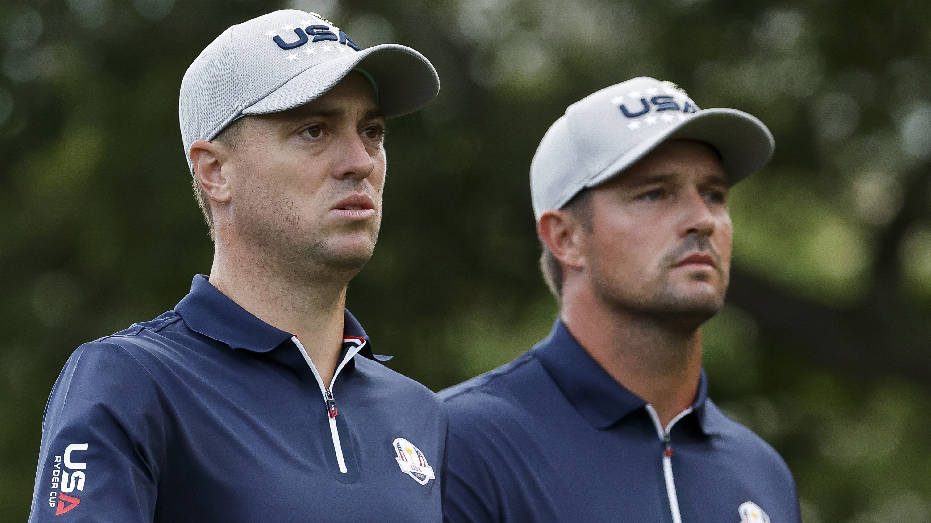 ustin Thomas and Bryson DeChambeau of Team United States leave the third tee during the Friday morning foursomes matches of the 2025 Ryder Cup at Black Course at Bethpage State Park Golf Course on September 26, 2025 in Farmingdale, New York.
