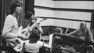 English progressive rock band Yes recording their 'Fragile' LP at Advision Studios in London, 20th August 1971. From left to right, bassist Chris Squire, guitarist Steve Howe, singer Jon Anderson (facing away) and keyboard player Rick Wakeman. (Photo by Michael Putland/Getty Images)