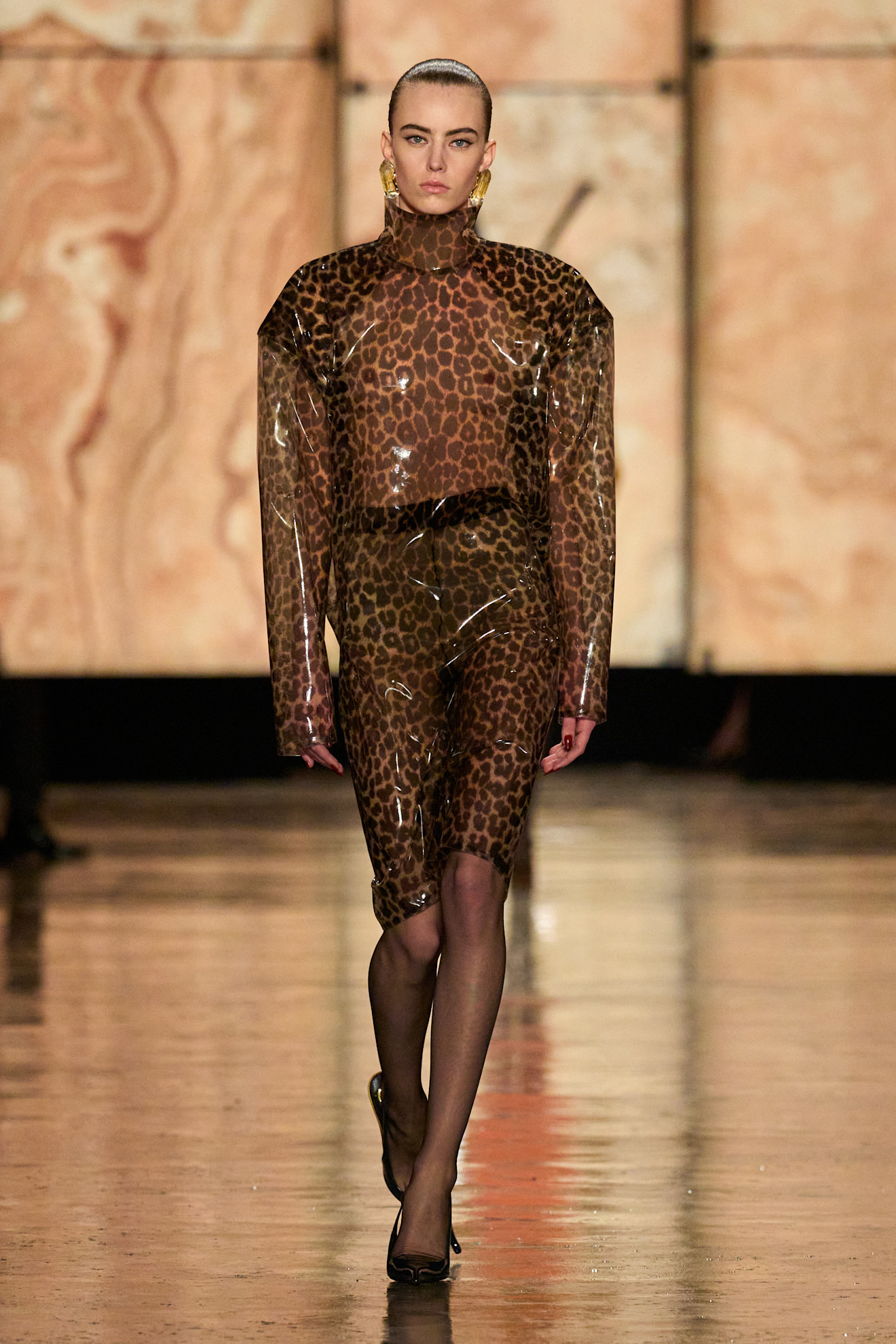 Model walking in Saint Laurent Fall Winter 2025 show.
