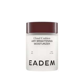 A product image of the Eadem Brightening Moisturizer in a white bottle and brown screw-on top for Black-owned beauty and skincare products.