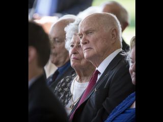 Former Sen. John Glenn and his wife Annie listen during a memorial service celebrating the life of Neil Armstrong, Friday, Aug. 31, 2012, at the Camargo Club in Cincinnati.