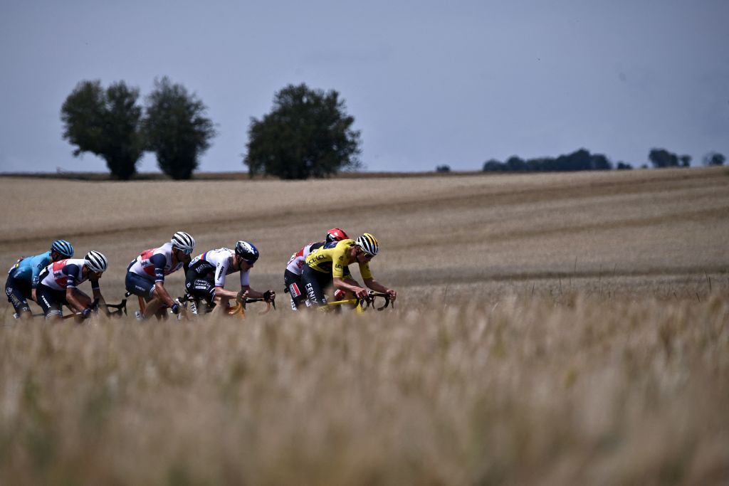 Team Alpecin Fenix Mathieu van der Poel of Netherlands wearing the overall leaders yellow jersey leads the breakaway during the 7th stage of the 108th edition of the Tour de France cycling race 249 km between Vierzon and Le Creusot on July 02 2021 Photo by AnneChristine POUJOULAT AFP Photo by ANNECHRISTINE POUJOULATAFP via Getty Images
