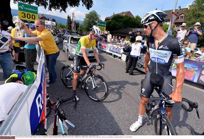 Boonen and Martin check on Cavendish after the stage