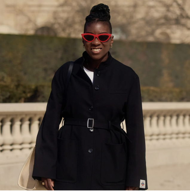 Nikki Ogunnaike wearing a black blazer and red sunglasses