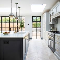 Metal framed glazing, including patio doors and full-height window in contemporary kitchen