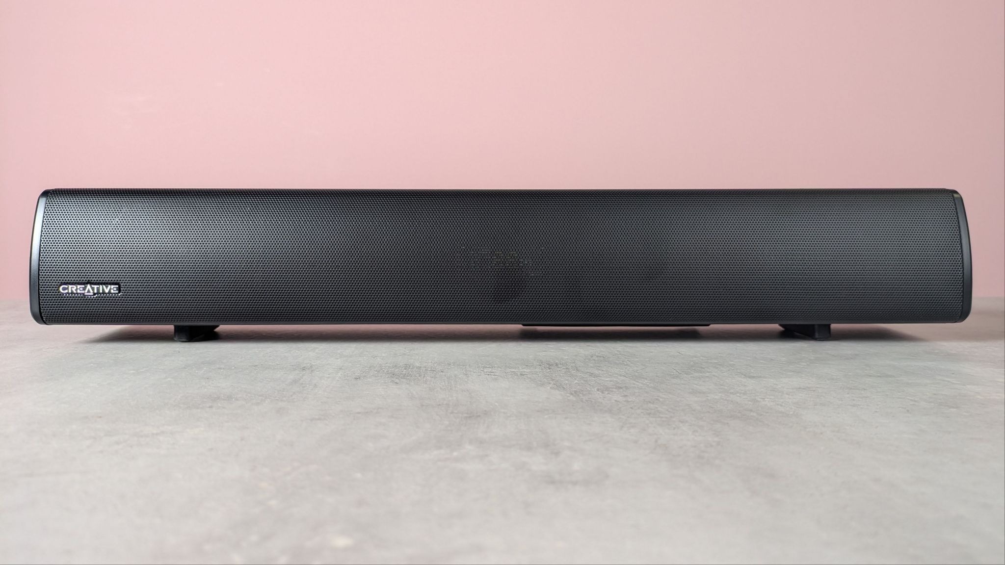Creative Sound Blaster GS5 on a desk with pink wall in background