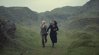 Ciri and Yennefer run across a green hill in The Witcher season 3 volume 2