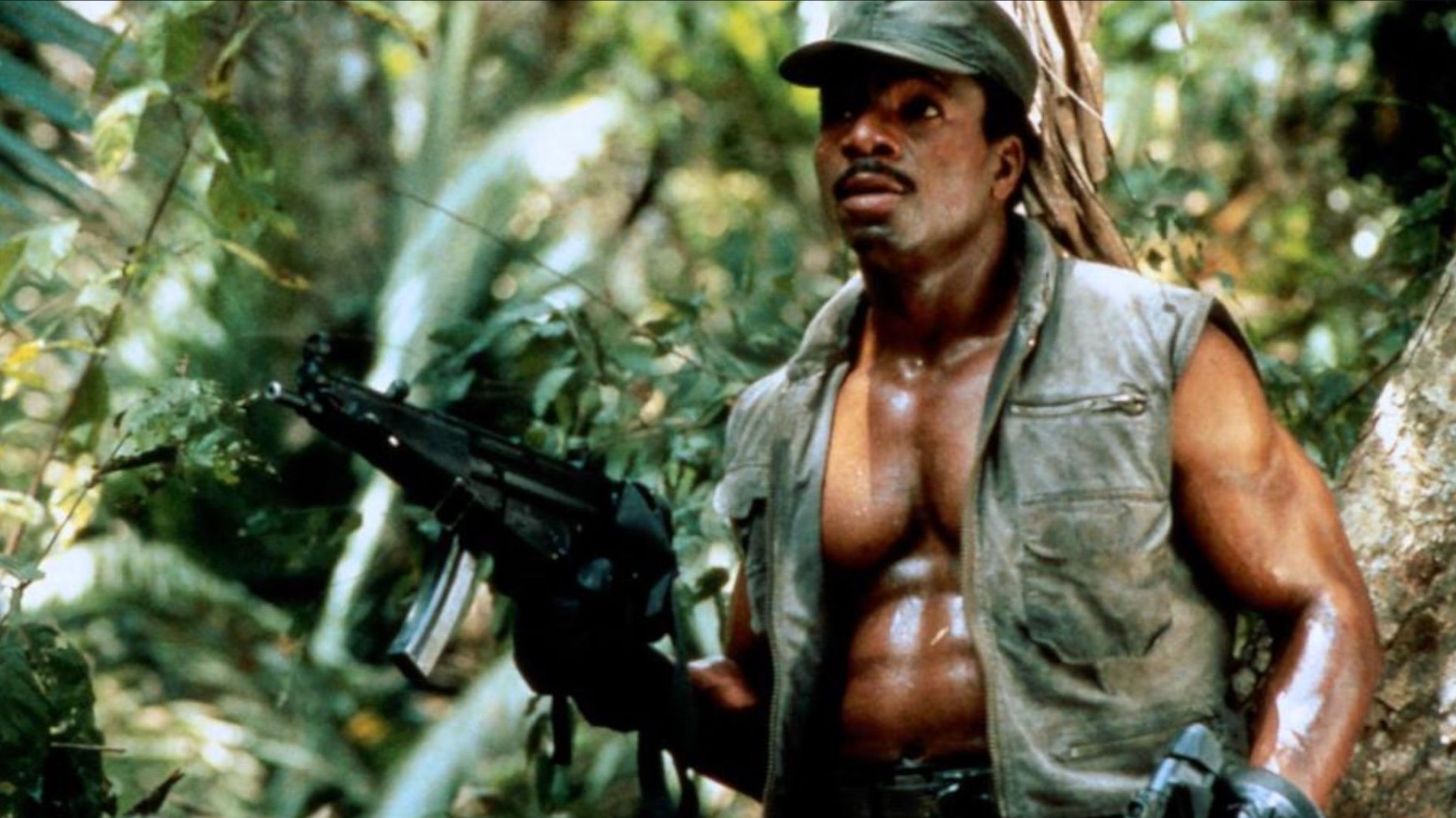a man in army fatigues in the jungle
