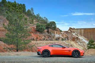 Aston Martin Vantage in front of hillside