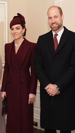 Prince William and Catherine, Princess of Wales wait to greet the Amir of Qatar