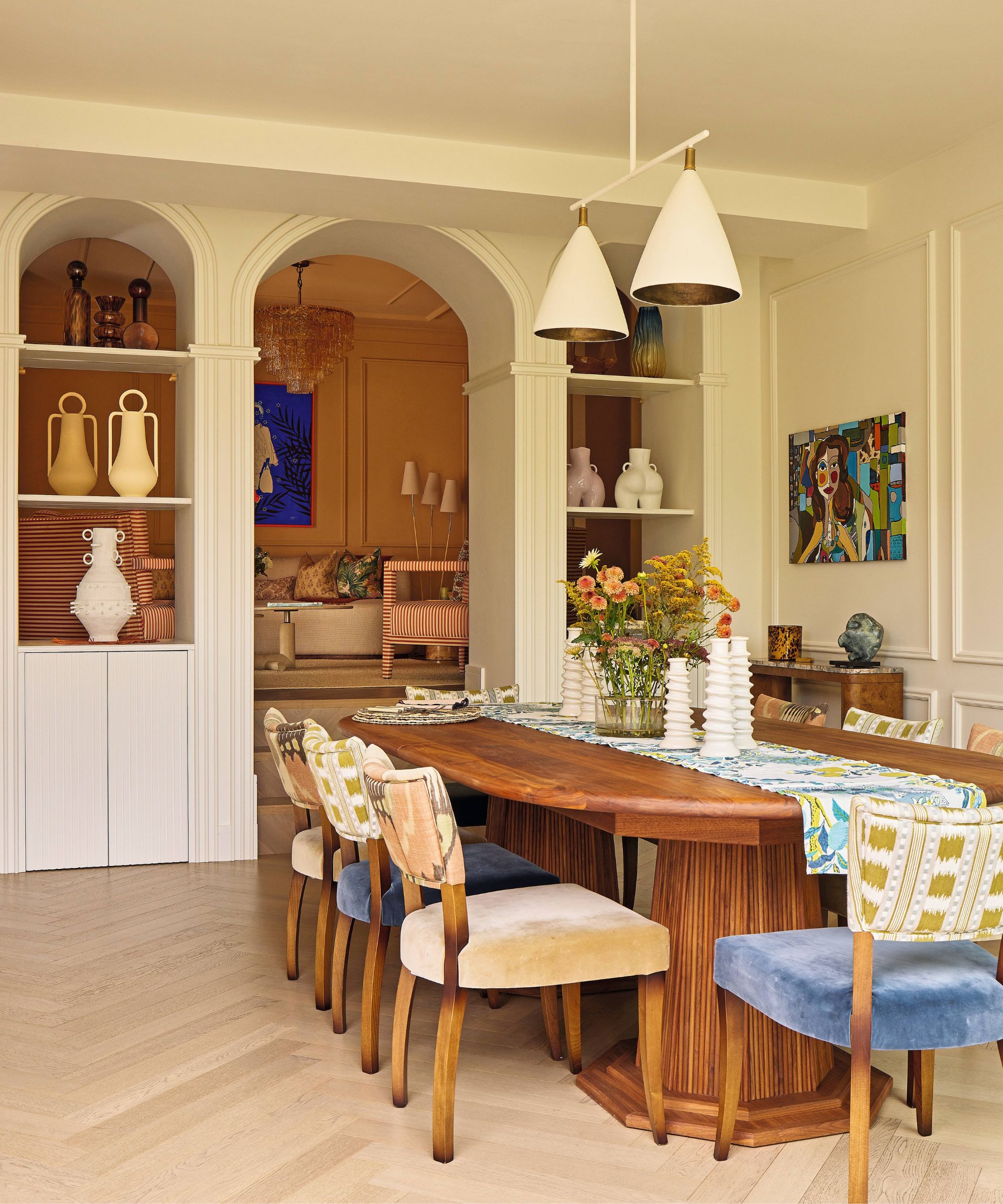 a warm neutral dining room with arched entryway