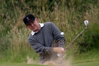 Tony Johnstone plays a bunker shot